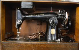 Cased Singer electric sewing machine
