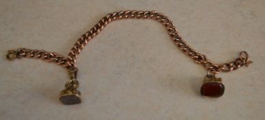 Tested as 9ct rose gold bracelet with two yellow metal fobs/seals, total approx weight 13.