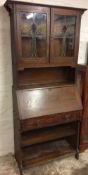 Early 20th century oak bureau bookcase with stained glass panels