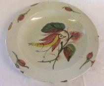 18th century tin glaze charger with polychrome bird decoration AF Dia 30.