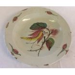 18th century tin glaze charger with polychrome bird decoration AF Dia 30.