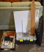 Various artists equipment including paints, small easel, folder,