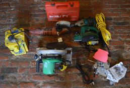 Various power tools including a Makita hammer drill, Hitachi circular saw,