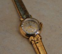 9ct gold ladies Omega cocktail watch on a 9ct gold strap, total weight 21.