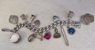 Silver charm bracelet with silver & white metal charms total weight 4.
