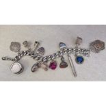 Silver charm bracelet with silver & white metal charms total weight 4.