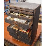 Chest of drawers full of watch parts, movements,