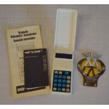 Sinclair Scientific calculator with instructions and an AA car badge