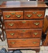 Georgian oak two over three chest of drawers with brass swan neck handles and bracket feet