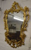 Ornate gilt framed wall mirror