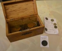 Coins in a wooden money box,