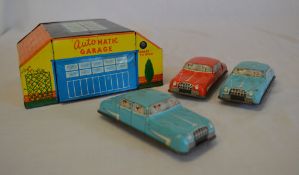 Approx 1930/50s tinplate small garage and 3 cars