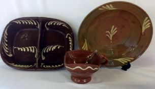 2 18th century slipware dishes & a cup (1 dish a/f)