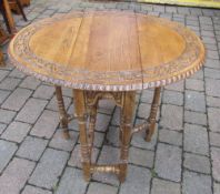 Carved oak gateleg table