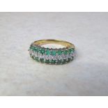 9ct gold emerald and diamond ring (diamonds total 0.