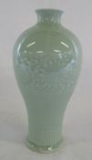 Chinese celedon baluster shaped vase with Qianlong seal mark to base,