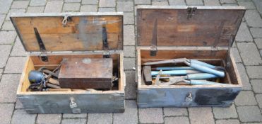 2 wooden trunks containing tools