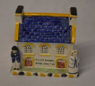 Staffordshire style money box in the shape of a house 'Alice Barnes, Born June 7th,