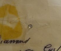 A small loose diamond, approx 0.