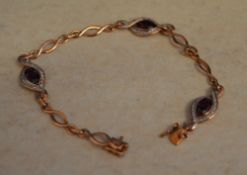 9ct gold bracelet with garnets and diamonds, total approx weight 6.