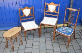 3 bedroom chairs and a small stool