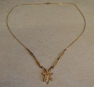 9ct gold pendant in the shape of a leaf on a 9ct gold chain, total approx weight 3.