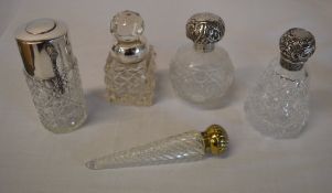 4 silver topped scent bottles and one similar