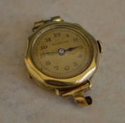 A 14ct gold 'Brevet DRGM' wristwatch with dial marked 'Dominador'