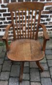 An early 20th century swivel chair with label J Elam Horncastle