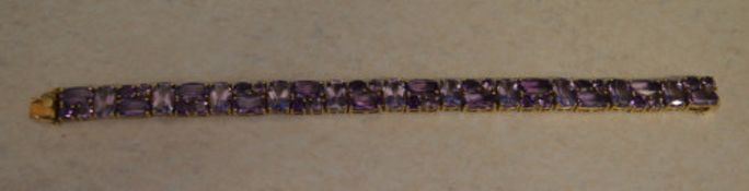 A stunning 9ct gold and amethyst bracelet, total approx weight 22.