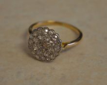 Tested as 18ct gold diamond cluster ring,