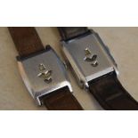 2 jump hour wristwatches on leather straps