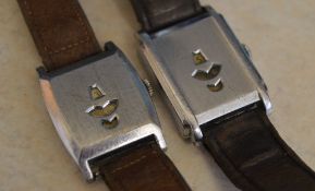 2 jump hour wristwatches on leather straps