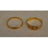 22ct gold wedding band (poor condition) and a yellow metal gypsy ring with poor hallmarks (AF)