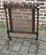 Cane work and carved firescreen