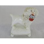 Staffordshire style porcelain poodle with basket