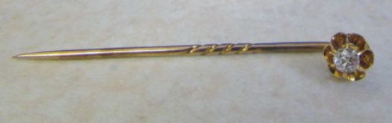 Tested as 9ct gold diamond stick pin total weight 1.5 g diamond approx 0.