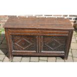 18th century oak coffer with carved panels on stile legs