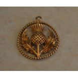 9ct gold fob in the shape of a thistle,