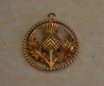 9ct gold fob in the shape of a thistle,