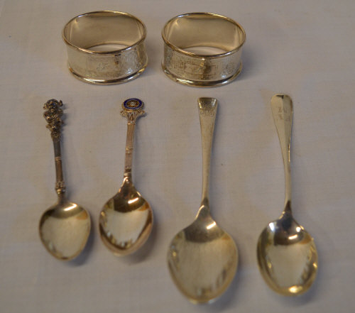 2 silver napkin rings and 4 silver spoons