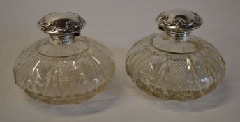 Pair of silver topped perfume bottles