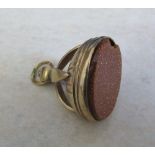 Tested as 9ct gold fob with brown goldstone (stone chipped) total weight 8.