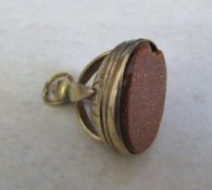 Tested as 9ct gold fob with brown goldstone (stone chipped) total weight 8.