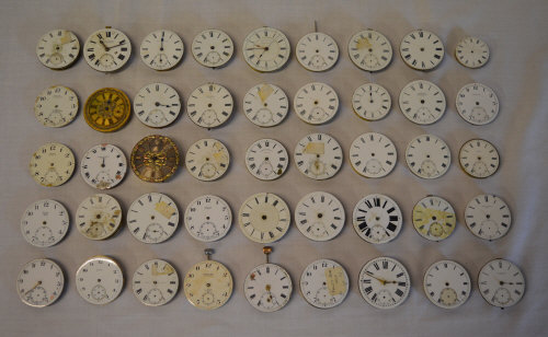 45 pocket watch movements and dials for spares or repairs, including makers Montine of Switzerland,