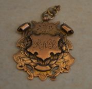 Large ornate 9ct gold fob with monogrammed cartouche, initials 'R.N.