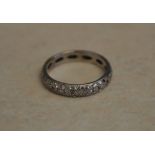 18ct white gold diamond chip eternity ring (some small stones missing) Ring Size N