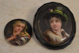 Small hand painted miniature plaque of a young girl with a dog and a similar jet mounted brooch