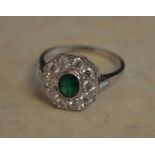 18ct white gold emerald and diamond octagonal cluster ring,