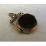 9ct gold fob with red stone (hallmarks indistinguishable) total weight 7.